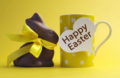Yellow Theme Happy Easter Polka Dot Breakfast Coffee Mug With Chocolate Bunny Rabbit Royalty Free Stock Photography Yellow Theme Happy Easter Polka Dot Breakfast Coffee Mug With Chocolate Bunny Rabbit Royalty Free Stock Photography