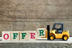 Yellow toy forklift hold letter block R to complete word offer royalty free stock photos Yellow toy forklift hold letter block R to complete word offer royalty free stock photos