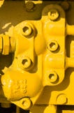 Yellow Unit With Bolt Heads Stock Photo