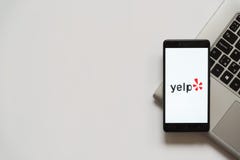 Yelp logo on smartphone screen