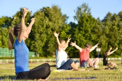 Yoga exercises class breathing technique group of people at the city stadium Russia, Kursk region, Zheleznogorsk, June 2018 stock photo Yoga exercises class breathing technique group of people at the city stadium Russia, Kursk region, Zheleznogorsk, June 2018 stock photo