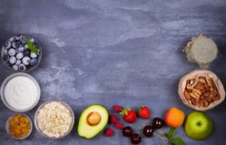 Yogurt, Oat Flakes, Fruits, Honey and Summer Berries. View from above, top studio shot of fruit background. Royalty Free Stock Photos Yogurt, Oat Flakes, Fruits, Honey and Summer Berries. View from above, top studio shot of fruit background. Royalty Free Stock Photos