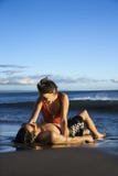 Young adult couple on beach.