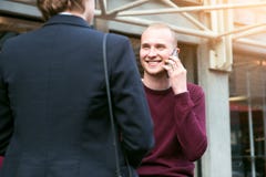 Young adult entrepreneurs people have business meeting talking on the street and making phone call stock image Young adult entrepreneurs people have business meeting talking on the street and making phone call stock image