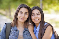 Young Adult Mixed Race Twin Sisters Portrait Outside royalty free stock photo Young Adult Mixed Race Twin Sisters Portrait Outside royalty free stock photo