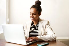 Young african american business woman working on laptop Royalty Free Stock Photo Young african american business woman working on laptop Royalty Free Stock Photo