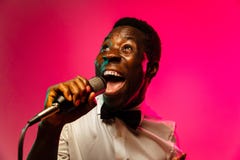Young african-american jazz musician singing a song stock image Young african-american jazz musician singing a song stock image