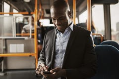 Young African businessman listening to music during his morning royalty free stock photography Young African businessman listening to music during his morning royalty free stock photography