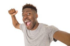 Young afro american man smiling happy taking selfie self portrait picture with mobile phone Royalty Free Stock Photos Young afro american man smiling happy taking selfie self portrait picture with mobile phone Royalty Free Stock Photos