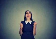 Young angry woman screaming loudly in great hysteria stock photo Young angry woman screaming loudly in great hysteria stock photo