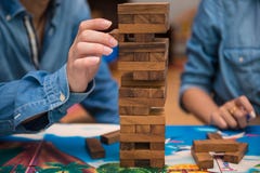 Young Are Playing Jenga Wood Game Stock Photography Young Are Playing Jenga Wood Game Stock Photography