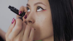 Young Asian Model`s Face During the Make-up Process.