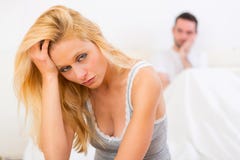Young attractive couple having an argue in bed stock photos Young attractive couple having an argue in bed stock photos
