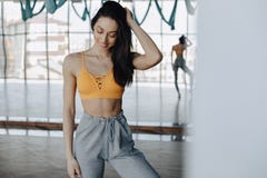 Young attractive girl posing at the gym, soft figure, fitness and yoga stock image Young attractive girl posing at the gym, soft figure, fitness and yoga stock image