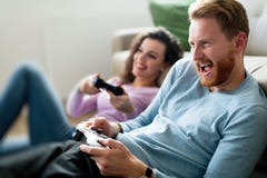 Happy couple playing video games at home Royalty Free Stock Photos Happy couple playing video games at home Royalty Free Stock Photos