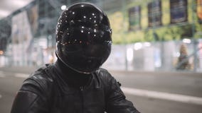 Young Attractive Man Motorcyclist With His Helmet And Custom Motorcycle On Night Street Stock Photos Young Attractive Man Motorcyclist With His Helmet And Custom Motorcycle On Night Street Stock Photos