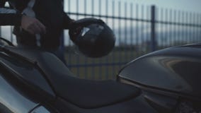 Young Attractive Motorcyclist With Black Helmet On Street. Man Motorcycle Biker Stock Photo Young Attractive Motorcyclist With Black Helmet On Street. Man Motorcycle Biker Stock Photo