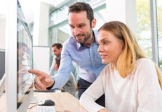 Young attractive people taking a training course with formator stock images Young attractive people taking a training course with formator stock images