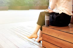 Young attractive woman at park, working with phone, drinking coffee, having lunch in a hurry. Business concept photo Royalty Free Stock Photos Young attractive woman at park, working with phone, drinking coffee, having lunch in a hurry. Business concept photo Royalty Free Stock Photos