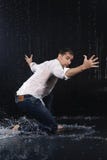 A young barefoot man wearing wet blue jeans and a white shirt ex royalty free stock image A young barefoot man wearing wet blue jeans and a white shirt ex royalty free stock image