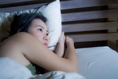 Young Beautiful Depressed And Sad Asian Chinese Woman Having Insomnia Lying In Bed At Night Sleepless Suffering Anxiety Stress And Stock Images Young Beautiful Depressed And Sad Asian Chinese Woman Having Insomnia Lying In Bed At Night Sleepless Suffering Anxiety Stress And Stock Images