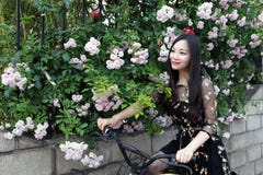 Young beautiful, elegantly dressed woman with bicycle. Healthy, cycling stock photo Young beautiful, elegantly dressed woman with bicycle. Healthy, cycling stock photo