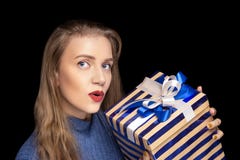 Young beautiful girl holds big gift box royalty free stock photo Young beautiful girl holds big gift box royalty free stock photo