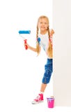 Young beautiful girl stands behind the corner Royalty Free Stock Image Young beautiful girl stands behind the corner Royalty Free Stock Image