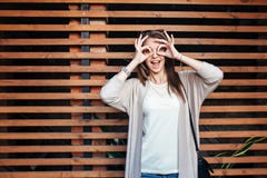 Young beautiful happy woman in casual cloths against wall royalty free stock image Young beautiful happy woman in casual cloths against wall royalty free stock image