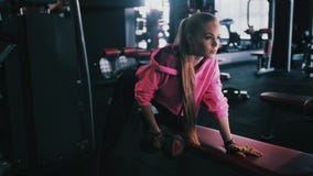 Young beautiful sporty girl with a rug. Fitness. Sport. stock footage Young beautiful sporty girl with a rug. Fitness. Sport. stock footage