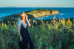 Young beautiful woman in autumn landscape with dry flowers, wheat spikes. Fashion autumn, winter. Sunny autumn, fashion photo stock images Young beautiful woman in autumn landscape with dry flowers, wheat spikes. Fashion autumn, winter. Sunny autumn, fashion photo stock images