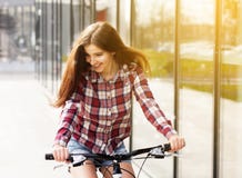 Young beautiful woman on a bicycle royalty free stock photography Young beautiful woman on a bicycle royalty free stock photography