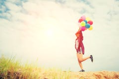 Young beautiful woman holding balloon very happy on the fresh ai stock photo Young beautiful woman holding balloon very happy on the fresh ai stock photo