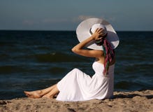 Young Beautiful Woman In A White Dress On The Beach Royalty Free Stock Photos Young Beautiful Woman In A White Dress On The Beach Royalty Free Stock Photos