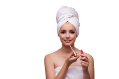 The young beautiful woman with lipstick on white royalty free stock image The young beautiful woman with lipstick on white royalty free stock image