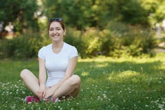 Young beautiful woman looking to camera - outdoor in nature. royalty free stock images Young beautiful woman looking to camera - outdoor in nature. royalty free stock images