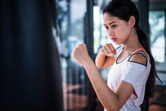 Young beautiful woman practicing boxing in gym. stock images Young beautiful woman practicing boxing in gym. stock images