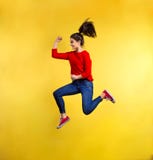 Young beautiful woman in studio, jumping. Stock Photos Young beautiful woman in studio, jumping. Stock Photos