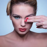 Young beauty woman covering one eye with her fingers royalty free stock images Young beauty woman covering one eye with her fingers royalty free stock images