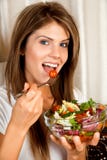 Young beauty woman eating salad Royalty Free Stock Photos Young beauty woman eating salad Royalty Free Stock Photos