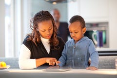 Young Black Family In Fresh Modern Kitchen Stock Photos