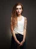 Young blond woman with tattoo stock photos Young blond woman with tattoo stock photos
