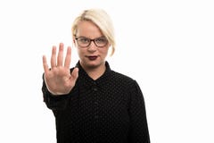 Young blonde female teacher wearing glasses showing stop gesture royalty free stock image Young blonde female teacher wearing glasses showing stop gesture royalty free stock image