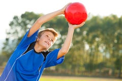 Young boy catching red ball outdoors. royalty free stock images Young boy catching red ball outdoors. royalty free stock images
