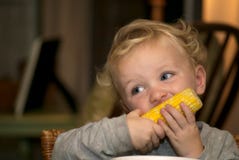 Young Boy Eating Corn On The Cob Stock Photo