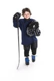 Young boy in ice hockey gear against white stock image Young boy in ice hockey gear against white stock image