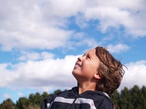Young boy looking skyward Stock Photo Young boy looking skyward Stock Photo