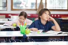 Young Boy Looking Up In Classroom Royalty Free Stock Photo Young Boy Looking Up In Classroom Royalty Free Stock Photo