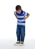 Young Boy On Scale Stock Image