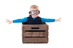 Young Boy Pilot Flying A Wood Box Royalty Free Stock Photos